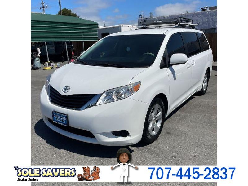 2012 Toyota Sienna 5dr 8-Pass Van V6 LE FWD (Natl) in White — front three-quarter view